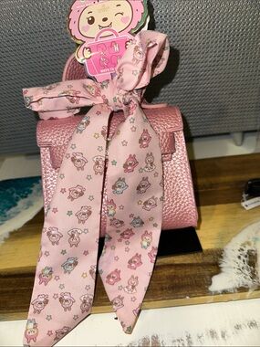 Pink Mini Kids purse with Decorative Bow Accent.